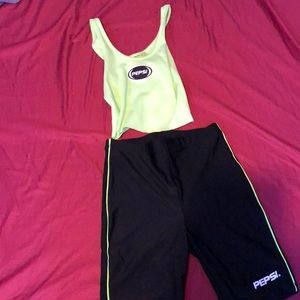 green crop top and black/green biker shorts Pepsi